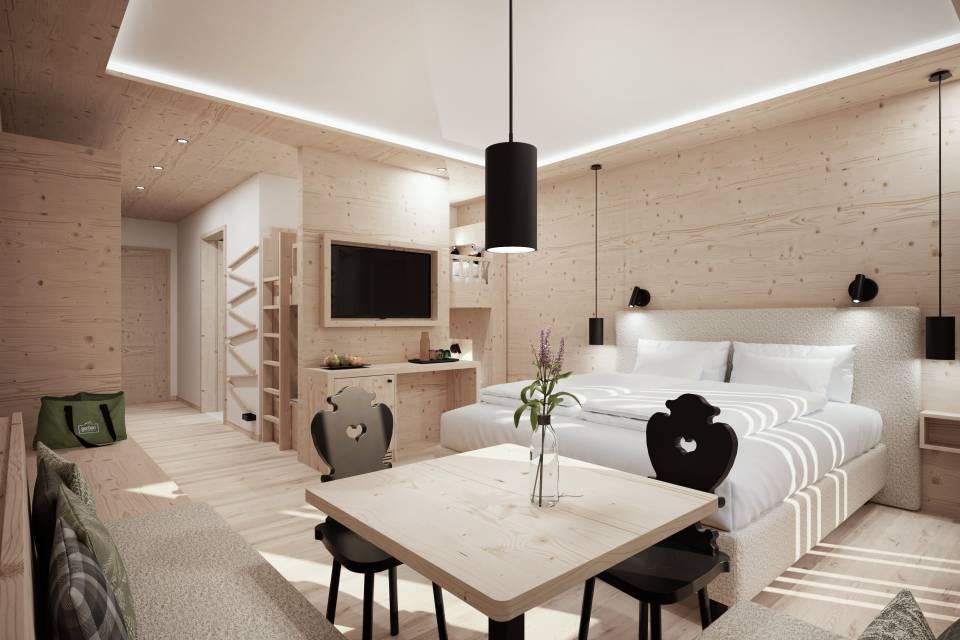 Familienzimmer mit Etagenbett und Eckbank im Familienhotel Gorfion Liechtenstein